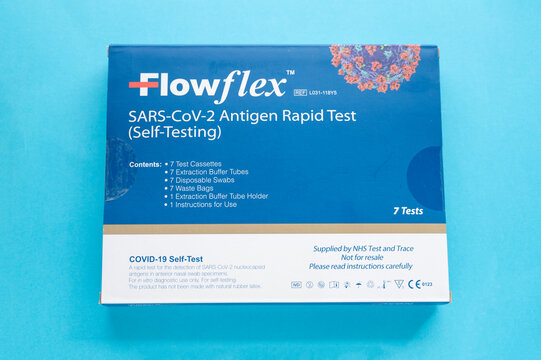 Corby, U.K - 15.10.2021: Flowflex speed coronavirus test in a box onblue background. Sars-Cov-2 antigen rapid test - illustrative editorial image.