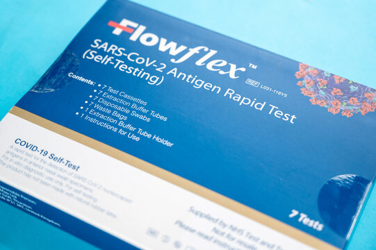 Corby, U.K - 15.10.2021: Flowflex speed coronavirus test in a box onblue background. Sars-Cov-2 antigen rapid test - illustrative editorial image.