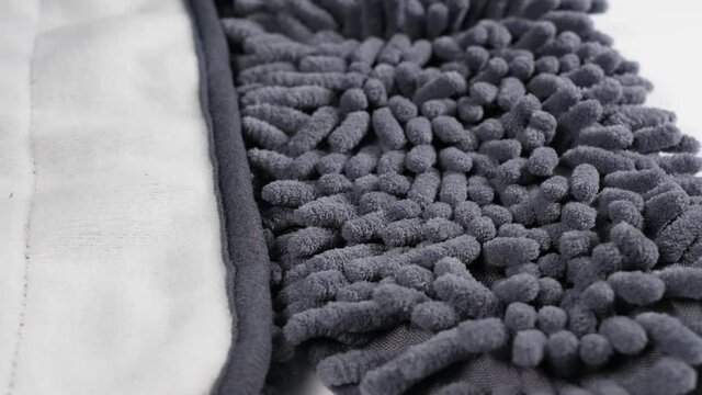 Closeup view 4k video footage of grey fluffy texture of mop of household cleaning tools