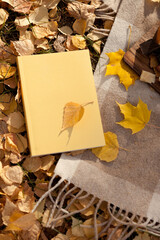 leaves on yellow book or planner on autumn leaves