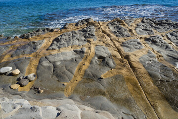 golden brown texture and rocks on the mediterranean coast in spain abstract background
