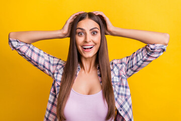 Fototapeta premium Photo of young woman happy positive smile amazed shocked wow news isolated over yellow color background