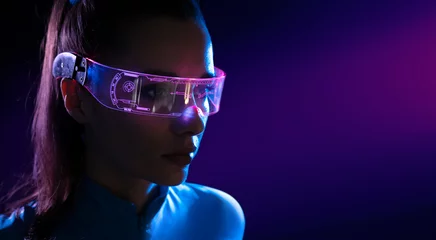 Poster Im Rahmen Concept of future technology or entertainment system, virtual reality. Female portrait lit by HUD interface © konradbak