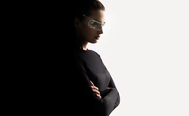 Poster Concept of future technology or entertainment system, virtual reality. Female portrait lit by HUD interface © konradbak