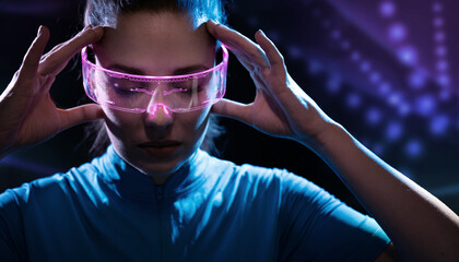 Concept of future technology or entertainment system, virtual reality. Female portrait lit by HUD interface - 463128388