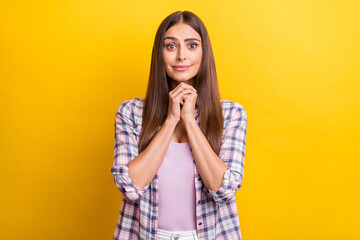 Photo of young attractive woman happy positive smile hands together please beg wait isolated over yellow color background - obrazy, fototapety, plakaty