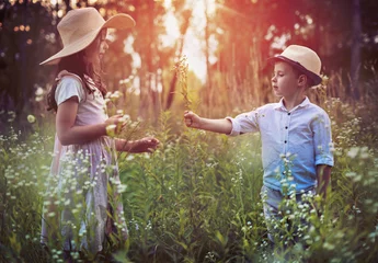 Foto op Plexiglas anti-reflex Cute siblings on a summer meadow © konradbak