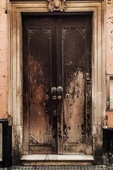 Fotobehang Detailed view of ancient street double door © konradbak
