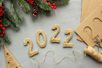 Step 6.DIY numbers 2022 made of cardboard and linen rope. The concept of preparing for Christmas and New Year.