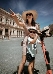 Foto op Plexiglas anti-reflex Young mother and her son on vacation in the city © konradbak