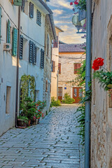 Fototapeta na wymiar Image of the historical center of the Croatian coastal town of Porec in the morning light during the sunrise