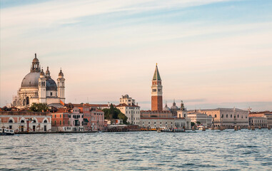 Towers and lagoon of Venice under blue evening sky. Historical landscape with old buildings of the ancient italian city