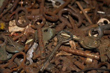 A pile of old rusty keys, close up