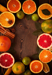 Frame from the citrus assortment, on a wooden table, top view, flat layout, no people, background, toned. 
