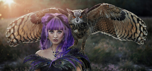 beautiful woman with owl in the nature