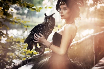 Poster Mystical brunette beauty posing in autumn scenery © konradbak