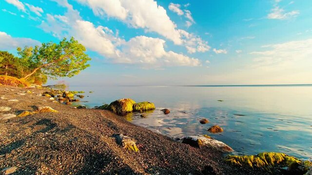 Scenic sunny beach panorama timelapse of Sevan lake. Popular holiday destination in Armenia. 4k high-quality footage
