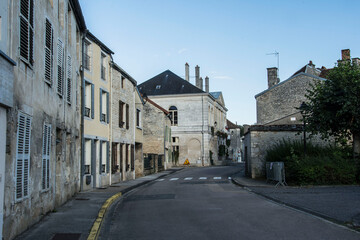 Fototapeta na wymiar streets with parked cars in the small village of Arc en Barrois in the French Champagne Ardenne in the evening
