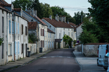 Fototapeta premium streets with parked cars in the small village of Arc en Barrois in the French Champagne Ardenne in the evening