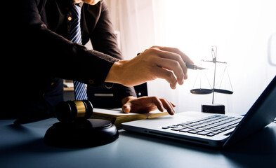 Close up lawyer businessman working or reading lawbook in office workplace for consultant lawyer concept.