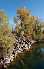 Old flooded quarry in autumn