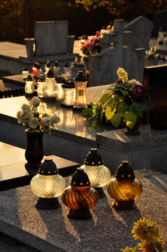 Gravelights on the cemetery during a sunset at autumn time