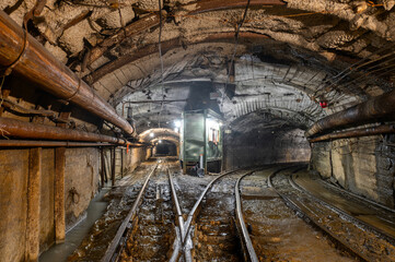 Underground mine. Underground railway for transporting ore. Mine trolley as part of an underground...