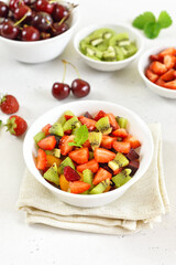 Healthy food fruit salad from kiwi and strawberry