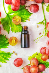 Grape seed oil in a bottle. Selective focus.
