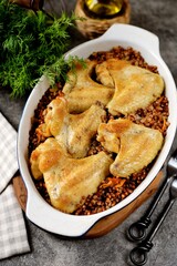 Chicken wings baked with buckwheat in the oven