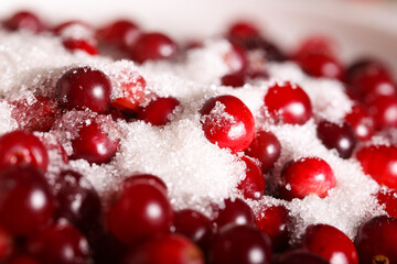 fresh cranberries with sugar are on the table
