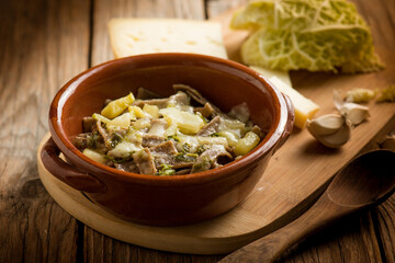 Pizzoccheri pasta with ingredients over wooden background