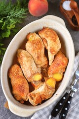 Turkey fillet rolls baked with peach slices.