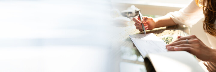 Businesswoman Signing Cheque