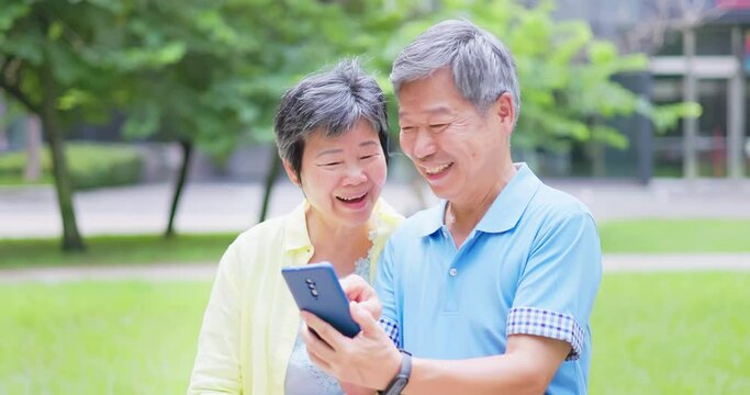 senior couple using smart phone