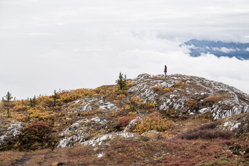 person on the mountain in autumn