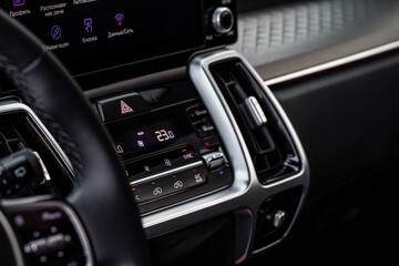 Fototapeta na wymiar Digital control panel car air conditioner dashboard. Modern car interior conditioning buttons inside a car close up view.