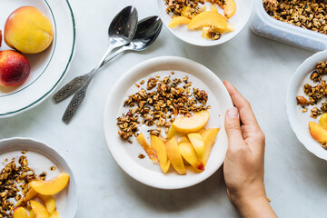 Crop hand holding bowl of muesli