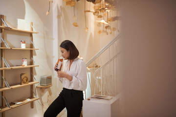 Girl is enjoying the aroma of tea and smiling