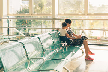 Mother and girl playing at station