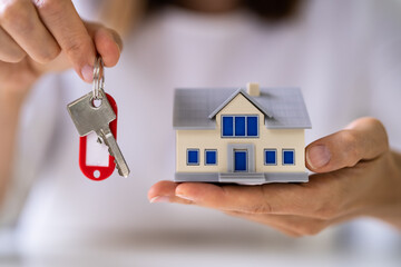 Buying New House Holding Keychain