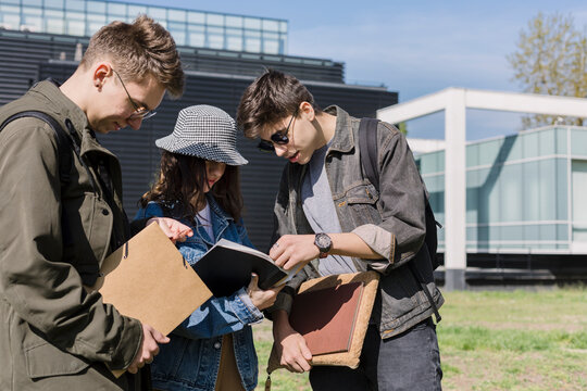 Students Sharing a Book