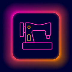 Glowing neon line Sewing machine icon isolated on black background. Colorful outline concept. Vector