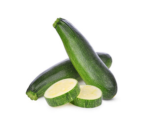 Whole zucchini and slices isolated on white background.