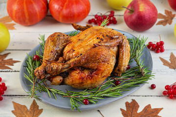 Baked whole chicken or turkey. Roasted homemade chicken with herbs. Thanksgiving day decoration