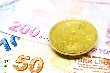 Bitcoin and Turkish lira concept. Bitcoin stands over the Turkish lira. Comparing bitcoin and Turkish lira. Bitcoin against Turkish lira. Cryptocurrency trading. 