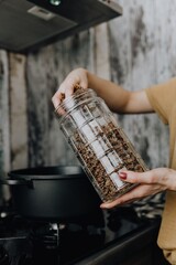 Hand of a woman preparing pasta