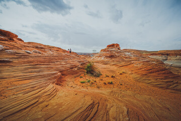 Red wavy sand stones, bluffs and cliffs at Glen Canyon National Recreation Area, Page, Arizona.