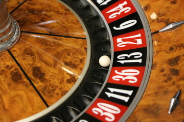 Obraz premium Roulette game. Black on 13. Number 13. Casino. To bet. Betting game. Luck. Ball in number thirteen. Entertainment. Play. Gambling and gambling addiction.