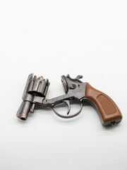 A metal pistol. A child's toy for playing war..